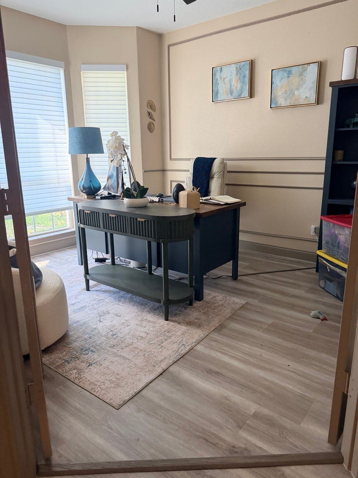 Home office with beige walls and taupe picture-frame wall molding