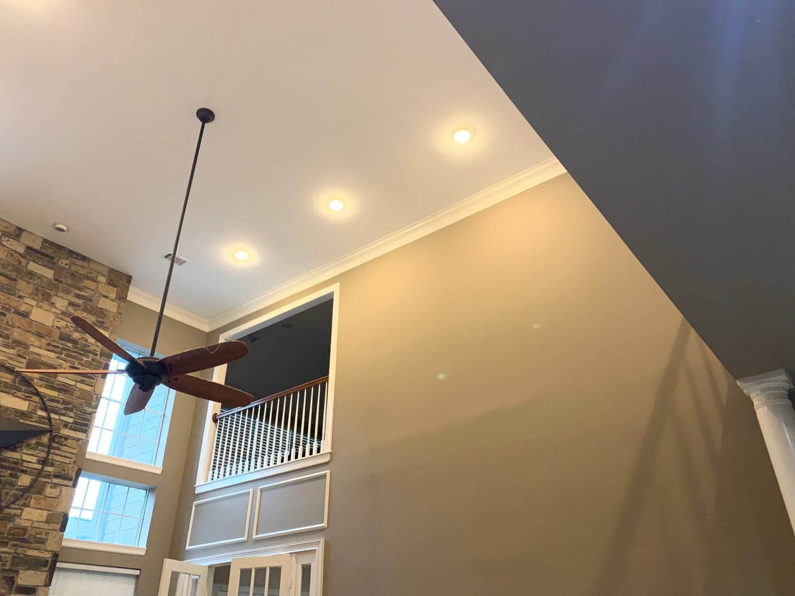 Great room ceiling, crown molding and the white overlook railing and panels