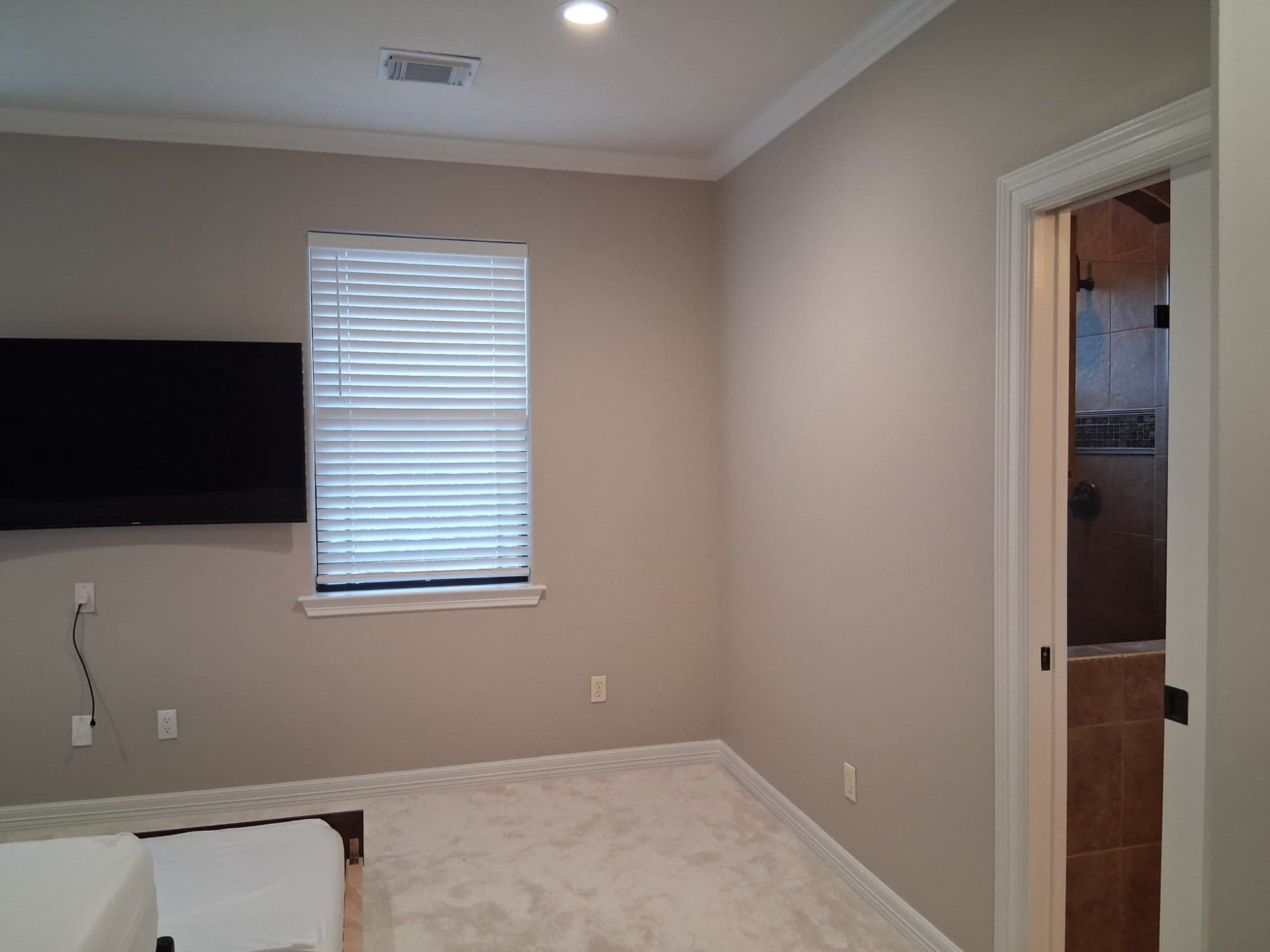 Second Richmond bedroom with greige walls, white crown molding and window trim
